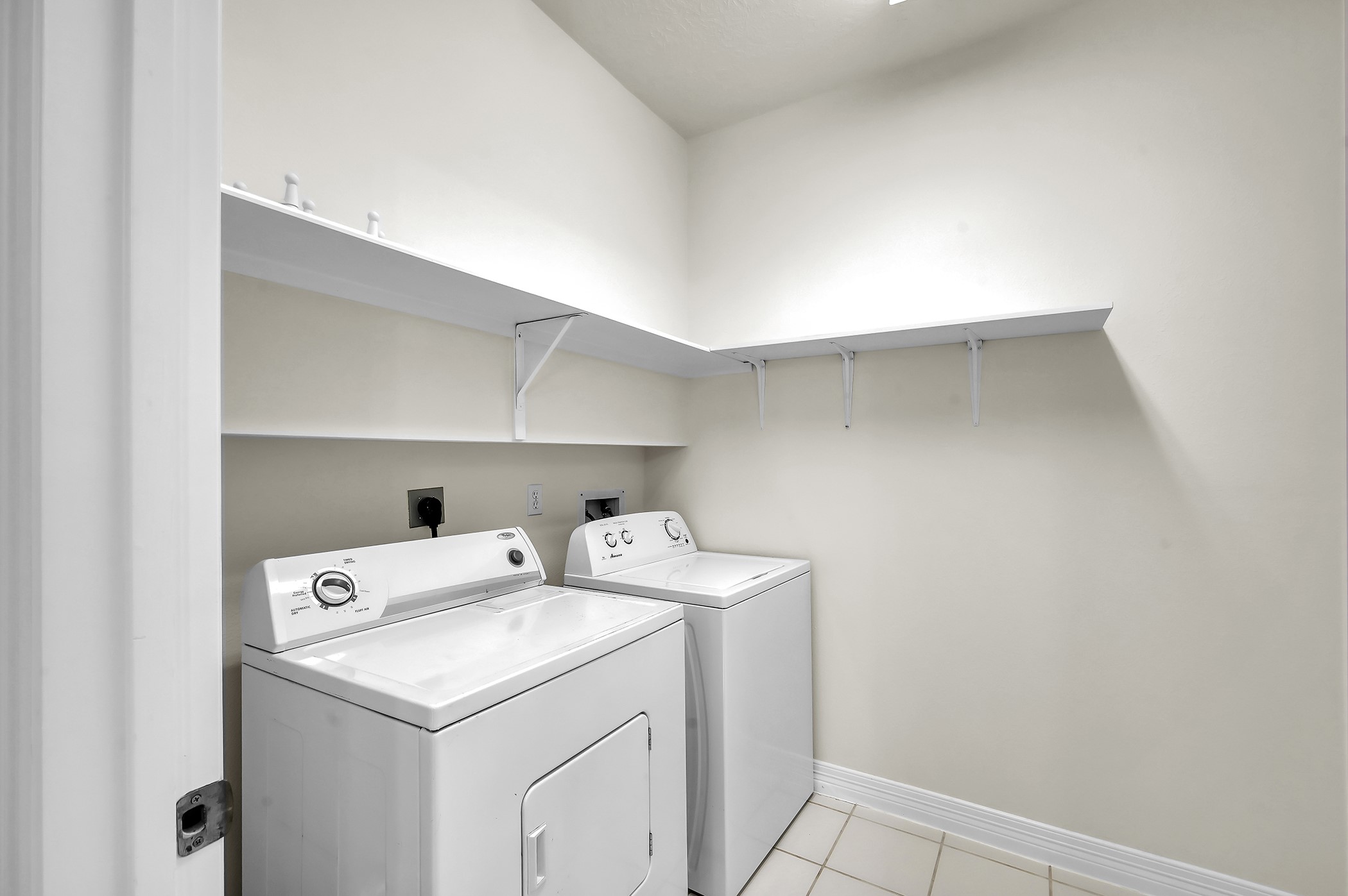 18310 Rittenhouse Park Court Spring, TX 77379 - Photo 15 of 35 Large utility room with fresh paint and a washer and dryer that stay with the house.