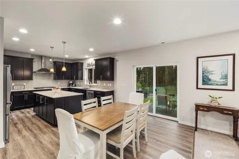 a kitchen with a table and chairs in it