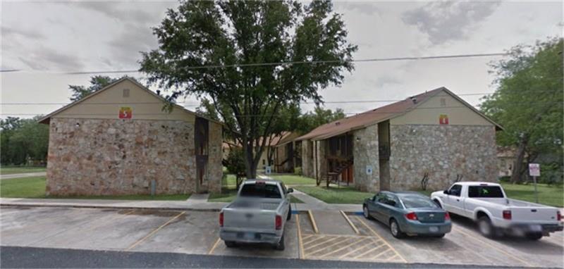 1410 Naples Street Castroville, TX 78009 - Photo 5 of 6 a couple of cars parked in front of a house