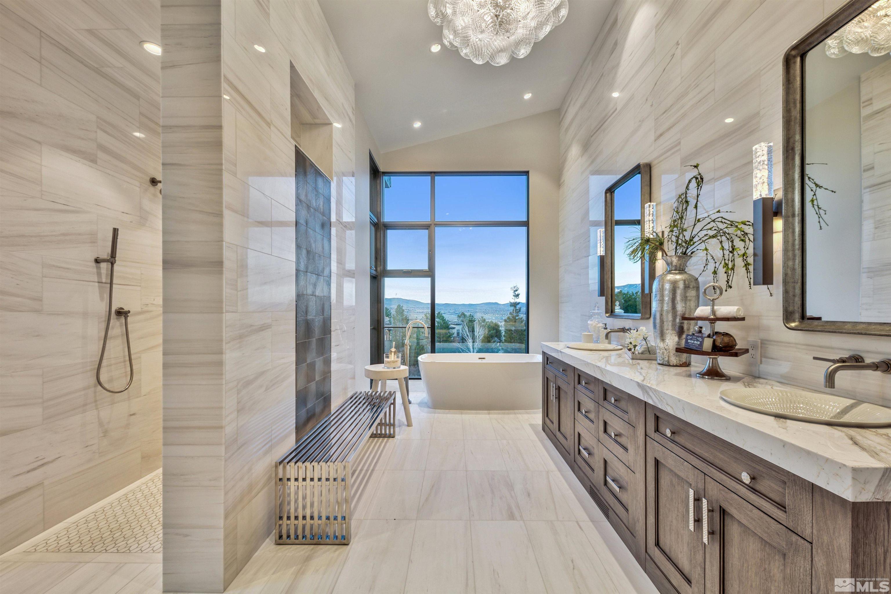 170 Hawken Road Reno, NV 89519 - Photo 14 of 26 a spacious bathroom with a double vanity sink a large mirror and shower
