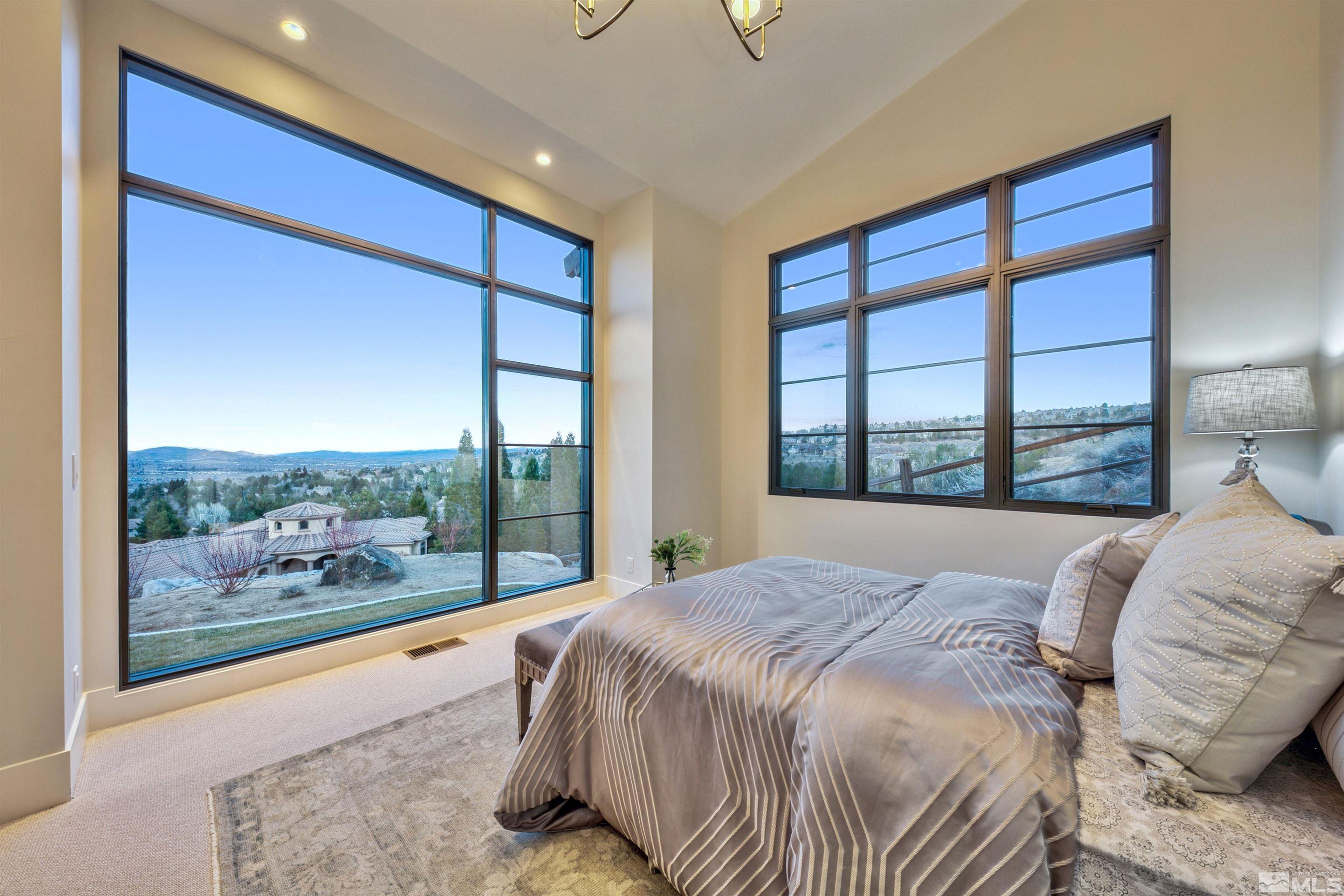 170 Hawken Road Reno, NV 89519 - Photo 16 of 26 a bed sitting in a bedroom next to a window