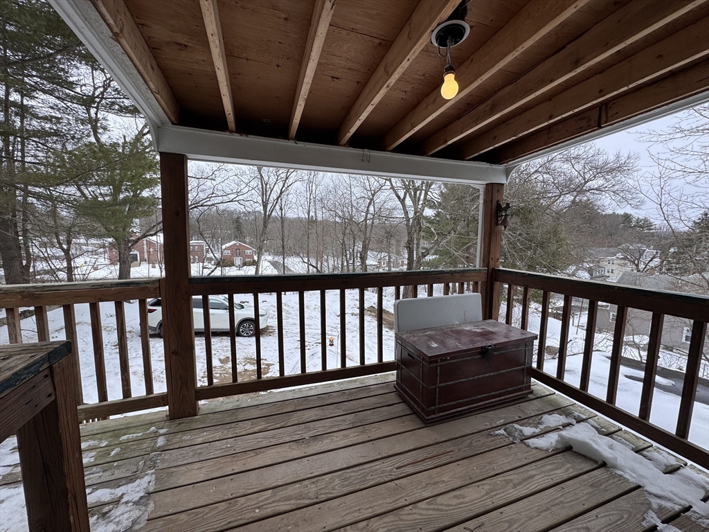 4 James Street, Unit 2 Dudley, MA 01571 - Photo 12 of 15 a view of a balcony with wooden floor
