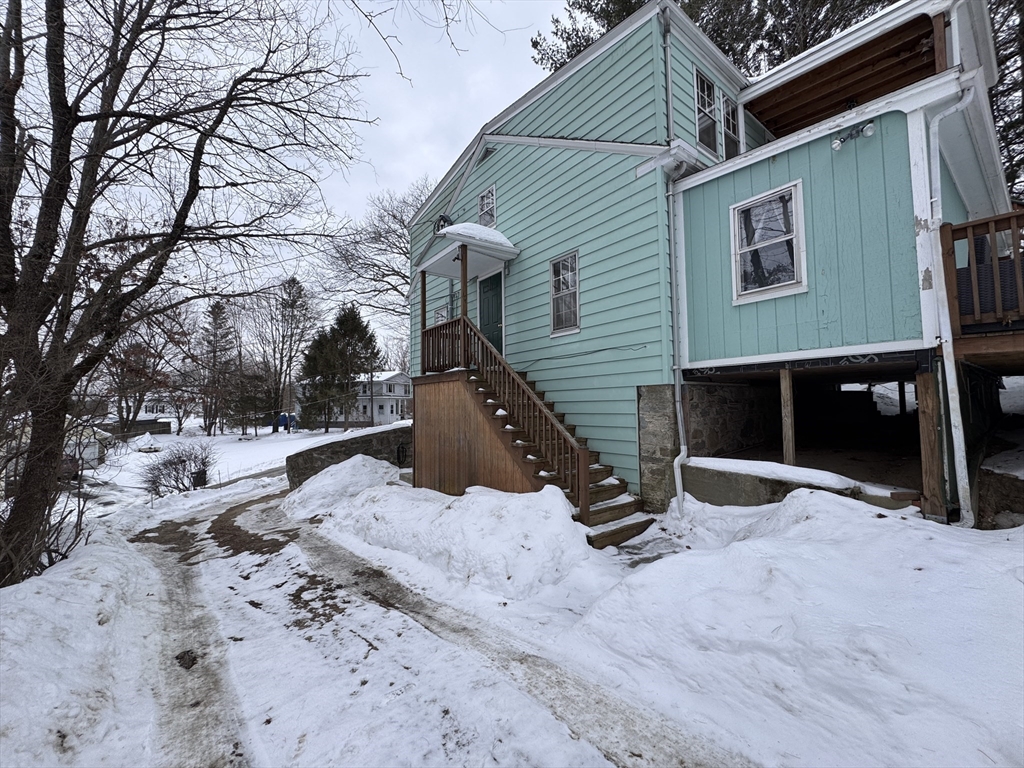 4 James Street, Unit 2 Dudley, MA 01571 - Photo 14 of 15 a view of a house with snow on the road