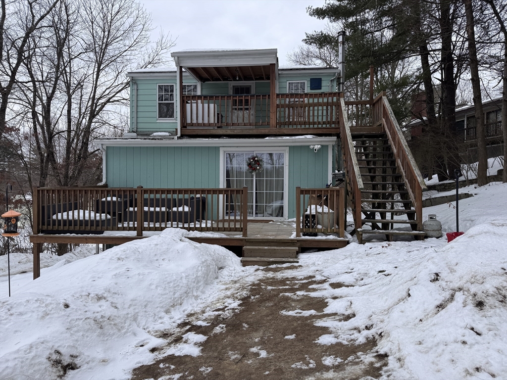 4 James Street, Unit 2 Dudley, MA 01571 - Photo 15 of 15 a view of a house with a snow in the yard
