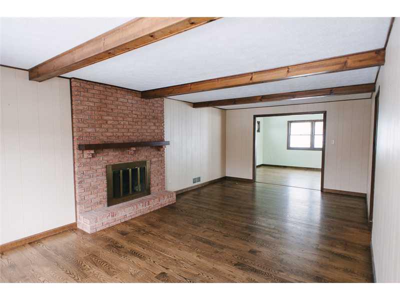 111 Thomas Road Canonsburg, PA 15317 - Photo 9 of 25 Family Room. The fireplace and wood beams makes this room very cozy.
