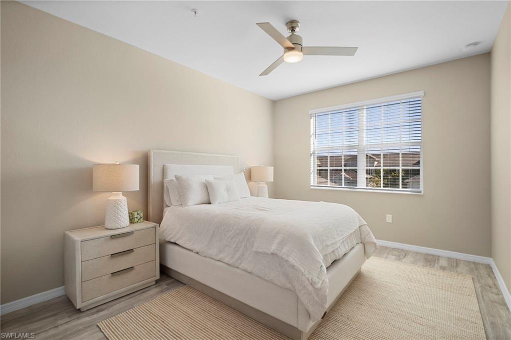 15194 Bluffton Lane, Unit 1422 Babcock Ranch, FL 33982 - Photo 31 of 35 a bedroom with a large bed and a window