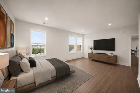 a view of a room with wooden floor
