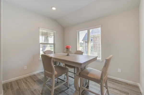a bedroom with a bed a tv and a fireplace