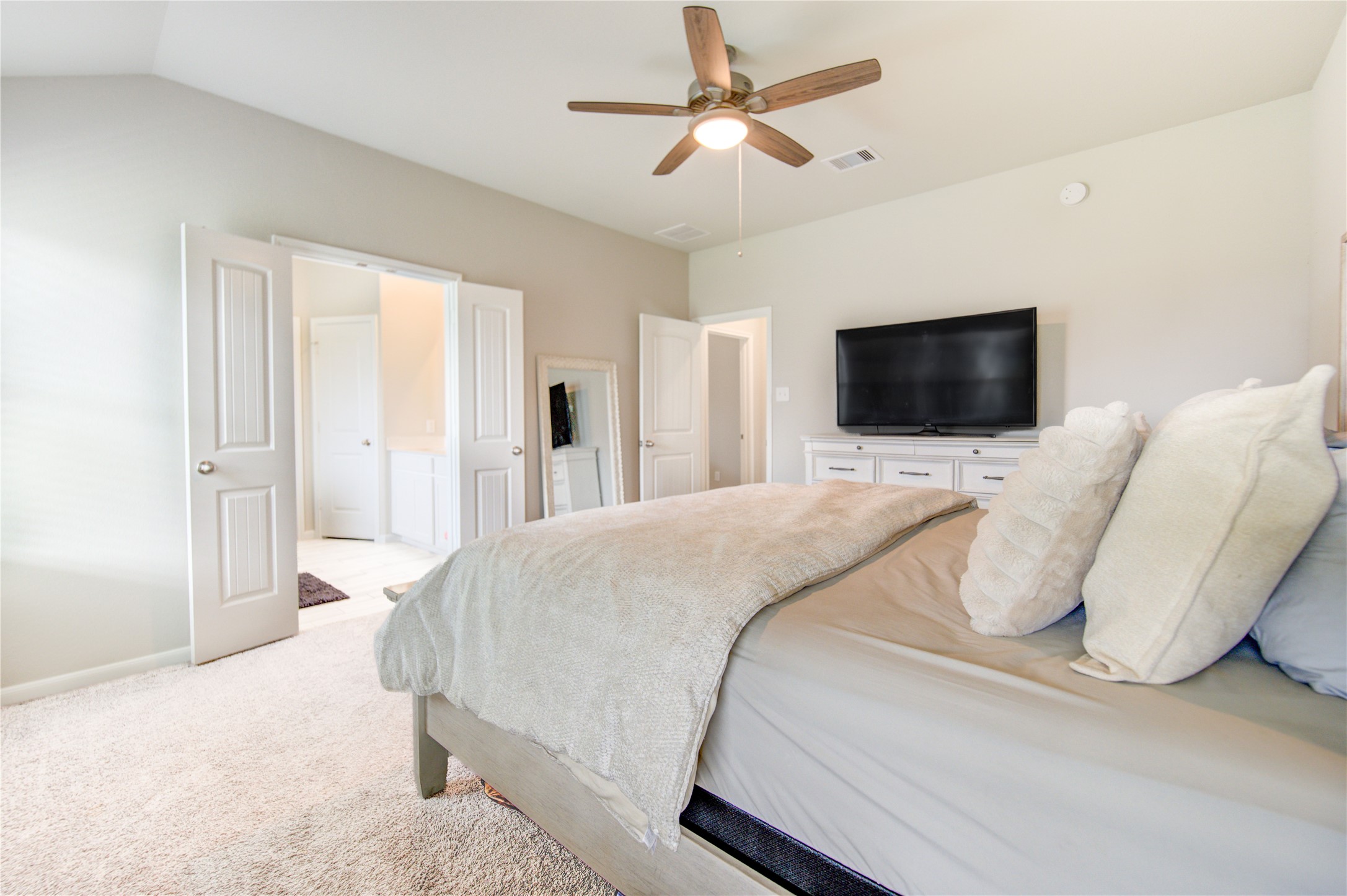 5011 Yellow Rays Trail Katy, TX 77493 - Photo 21 of 47 a bedroom with a bed and a flat screen tv