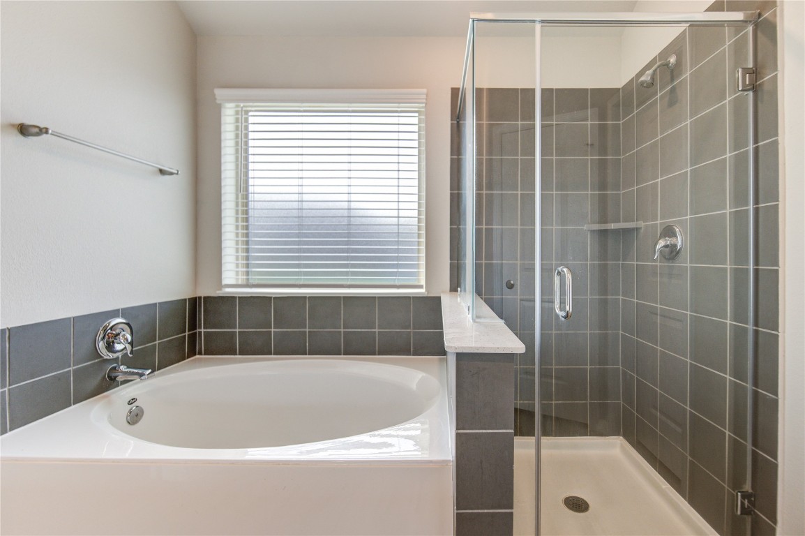 5011 Yellow Rays Trail Katy, TX 77493 - Photo 27 of 47 a bathroom with a bathtub and a shower