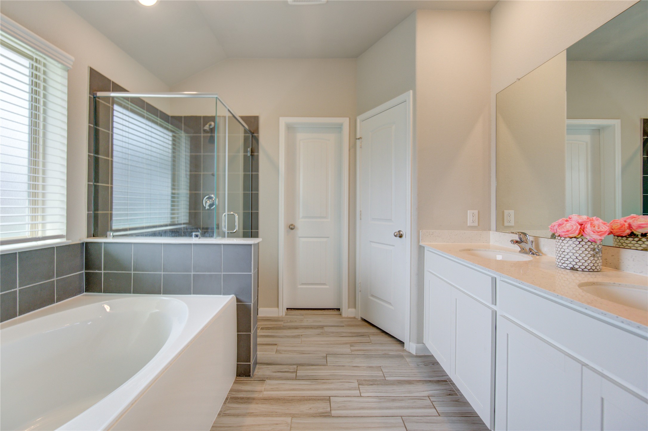 5011 Yellow Rays Trail Katy, TX 77493 - Photo 29 of 47 a bathroom with a tub sink and mirror