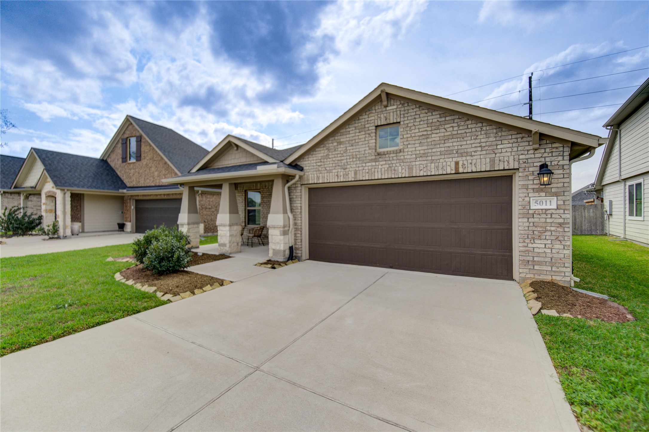 5011 Yellow Rays Trail Katy, TX 77493 - Photo 47 of 47 a front view of a house with a garden and plants