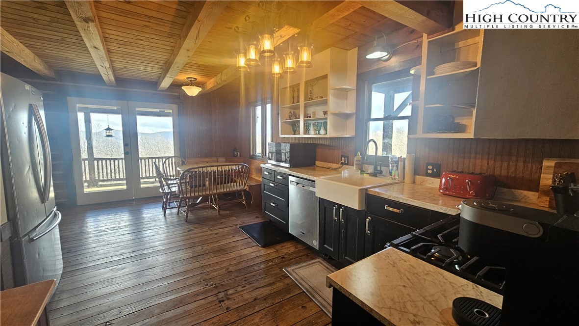 480 Schoolhouse Ridge Boone, NC 28607 - Photo 6 of 47 a kitchen with sink cabinets and wooden floor