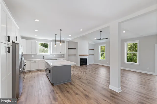 a view of kitchen with cabinets and wooden floor