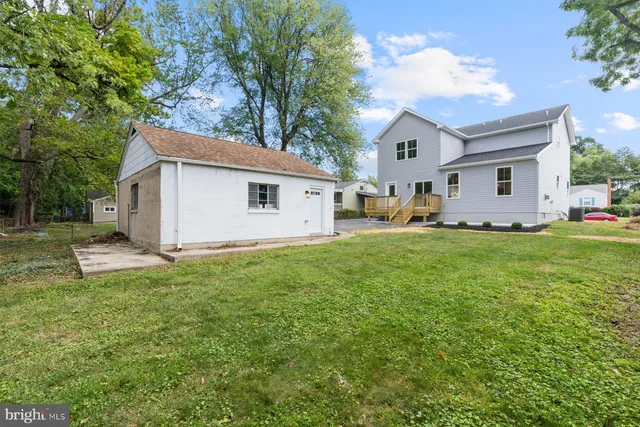 a front view of house with yard and seating area