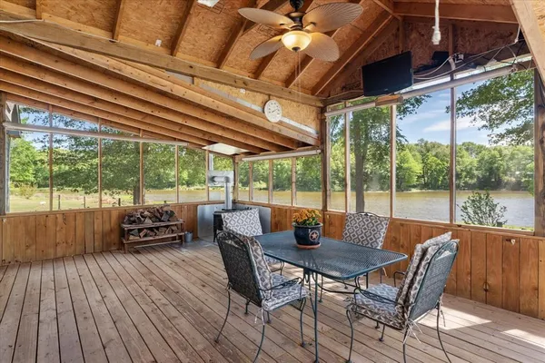 a dining room with furniture and wooden floor