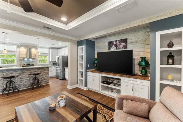 a living room with furniture and a flat screen tv
