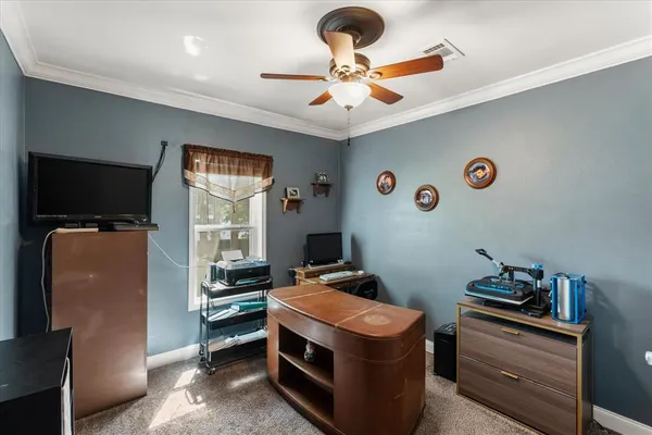a room with furniture and a flat screen tv