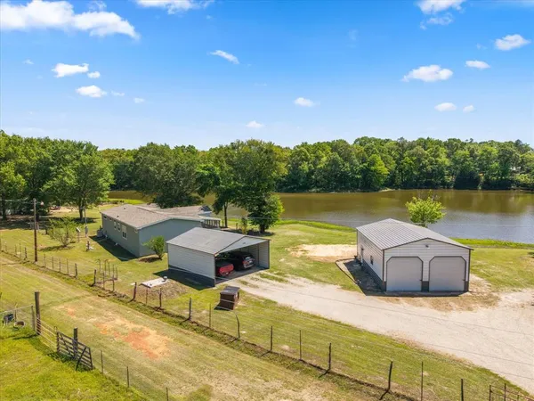 a view of a lake with couches and city view