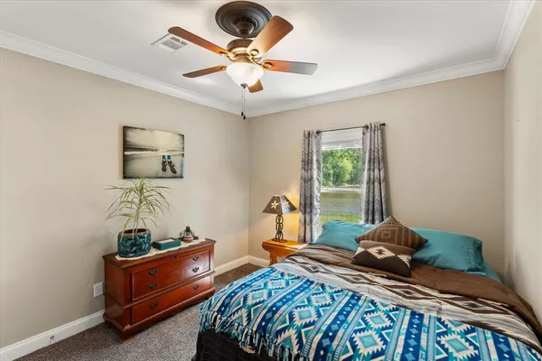 a bedroom with bed and a window