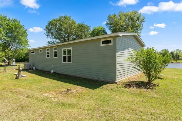 a view of a backyard with sitting area