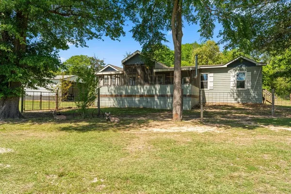 a view of a house with swimming pool