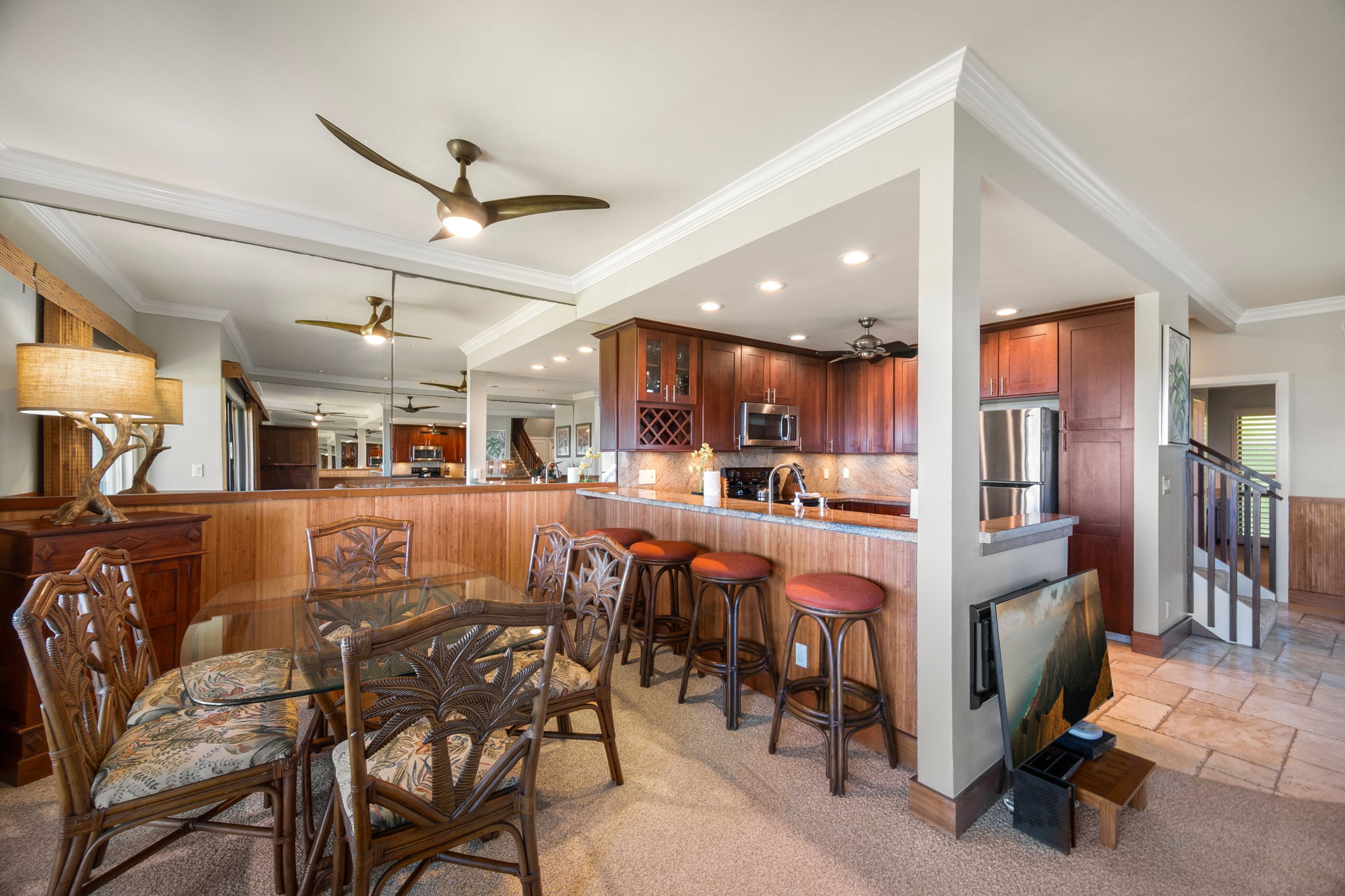 1565 Pe'e Road, Unit 222 Koloa, HI 96756 - Photo 5 of 24 a living room with stainless steel appliances kitchen island granite countertop furniture and a dining table