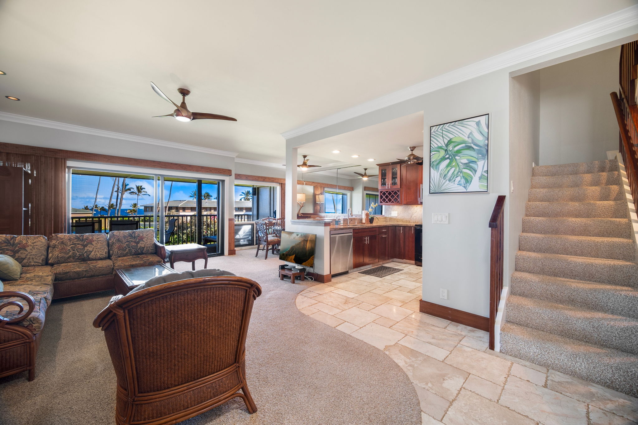 1565 Pe'e Road, Unit 222 Koloa, HI 96756 - Photo 8 of 24 a living room with furniture and a potted plant