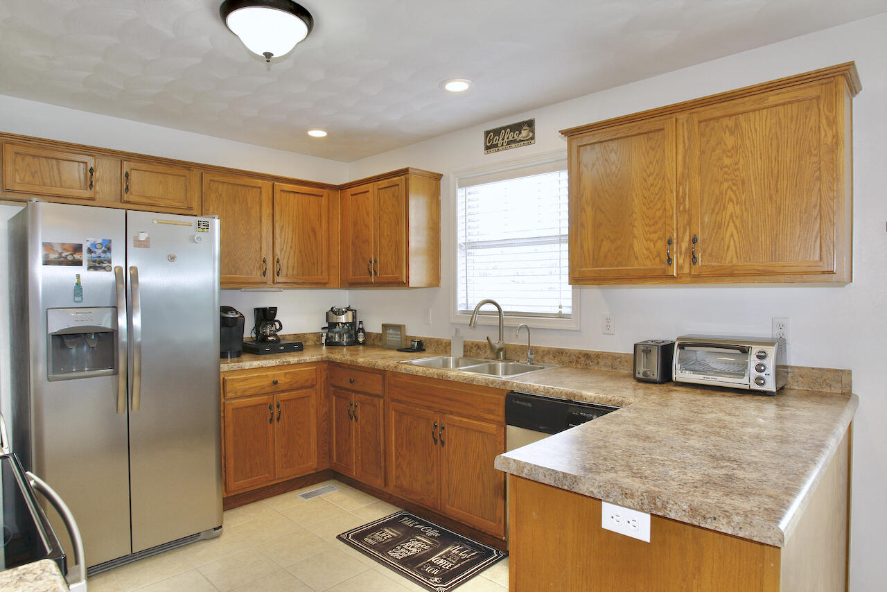 2444 Nemmo Road Vinton, VA 24179 - Photo 13 of 59 a kitchen with stainless steel appliances granite countertop a sink stove and refrigerator