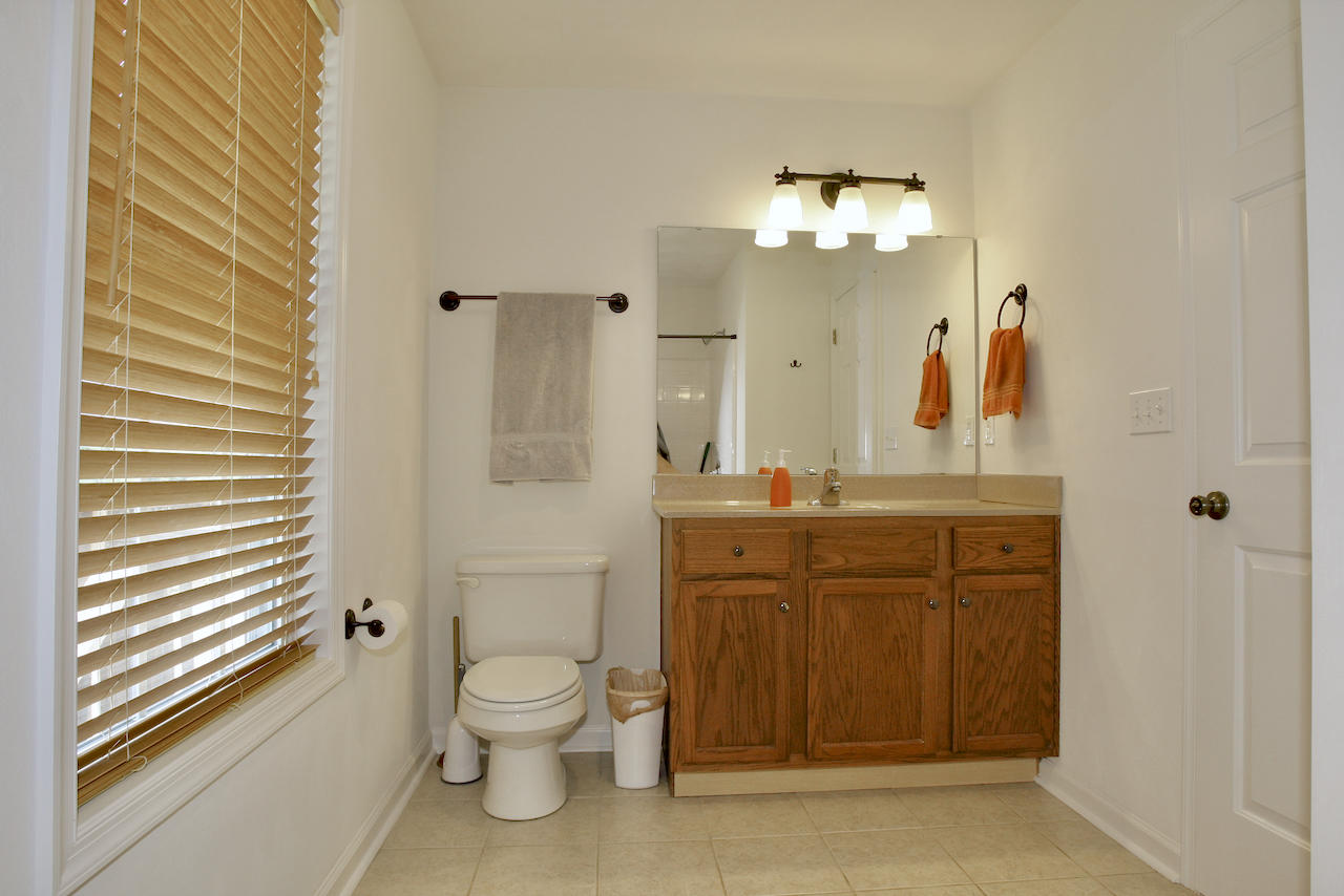 2444 Nemmo Road Vinton, VA 24179 - Photo 25 of 59 a bathroom with a toilet a sink and mirror