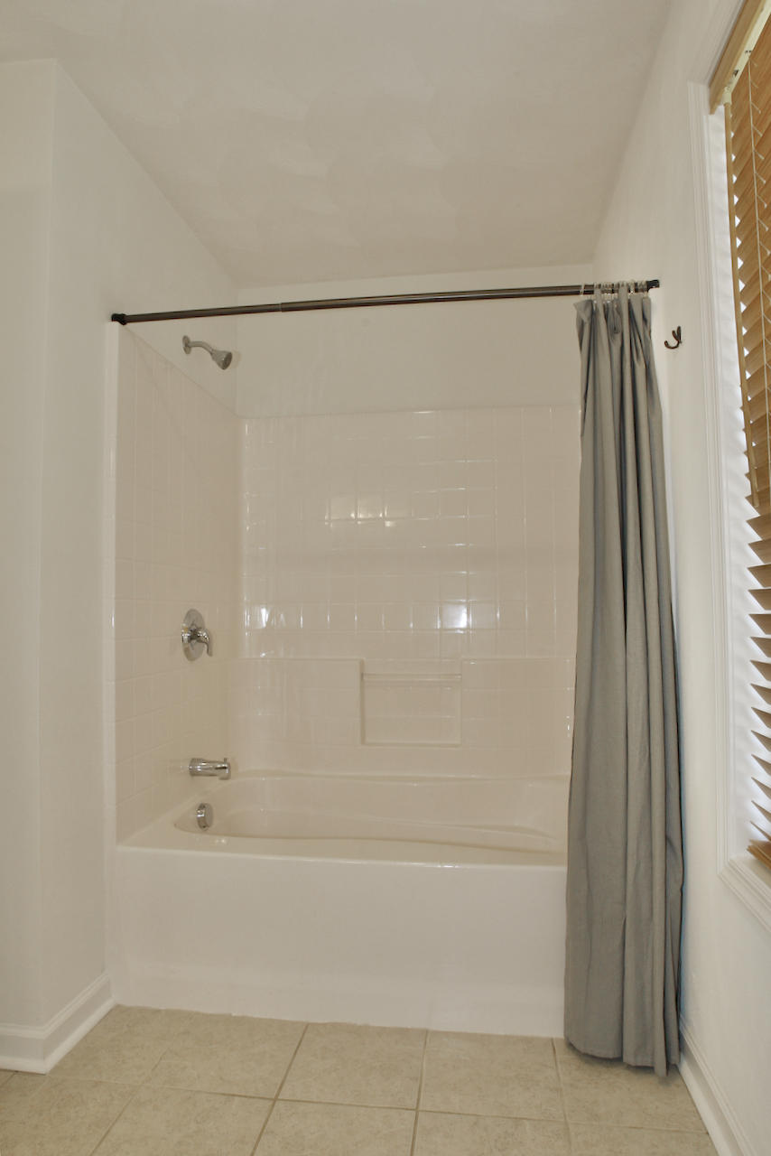 2444 Nemmo Road Vinton, VA 24179 - Photo 26 of 59 a bathroom with a bathtub and a shower