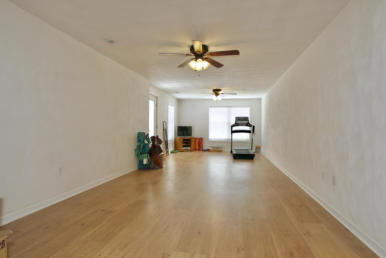 2444 Nemmo Road Vinton, VA 24179 - Photo 27 of 59 a view of a livingroom with a ceiling fan and hardwood floor