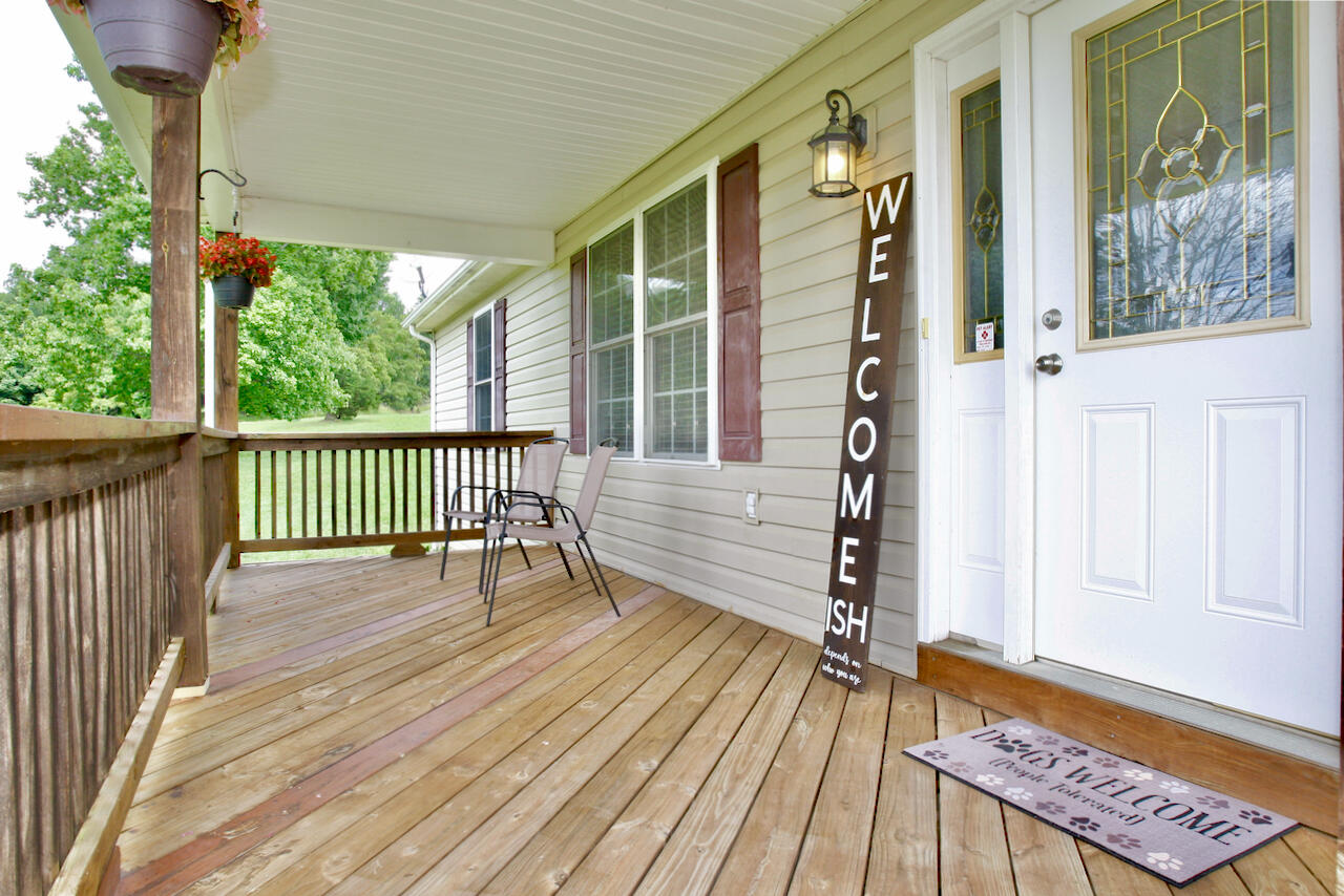 2444 Nemmo Road Vinton, VA 24179 - Photo 4 of 59 a view of a balcony with wooden floor and iron stairs