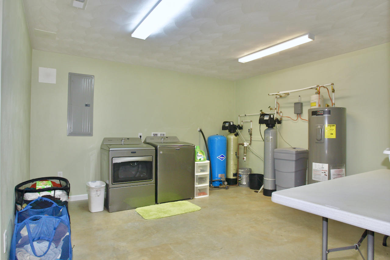 2444 Nemmo Road Vinton, VA 24179 - Photo 31 of 59 a bed room with a bed and gym equipment