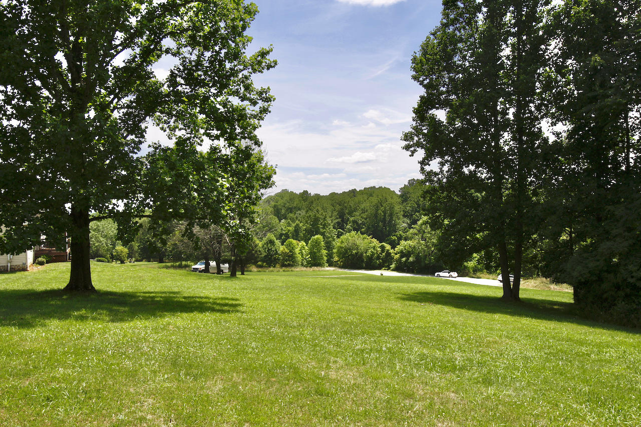 2444 Nemmo Road Vinton, VA 24179 - Photo 49 of 59 a view of grassy field with benches and trees all around