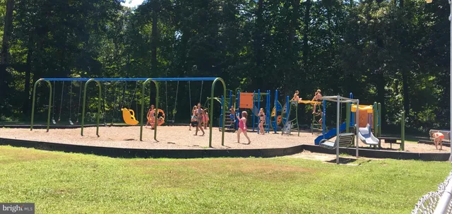 a view of a swimming pool with a table and chairs