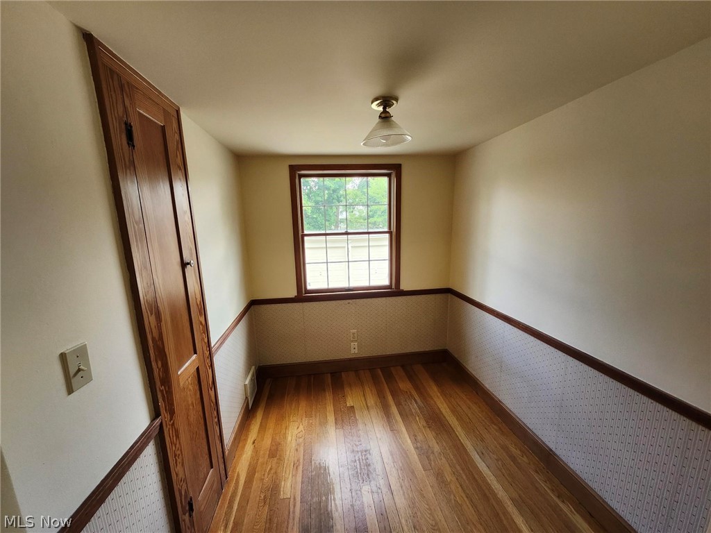 3819 Woodridge Road Cleveland Heights, OH 44121 - Photo 13 of 42 Unfurnished room with hardwood / wood-style floors
