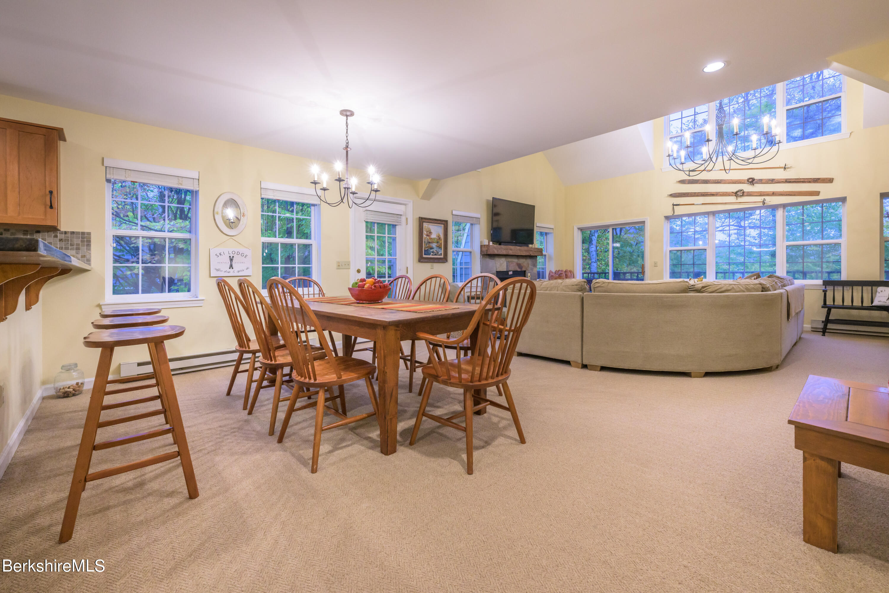 9341 Mountainside Drive Hancock, MA 01237 - Photo 16 of 43 a view of a dining room with furniture window and wooden floor