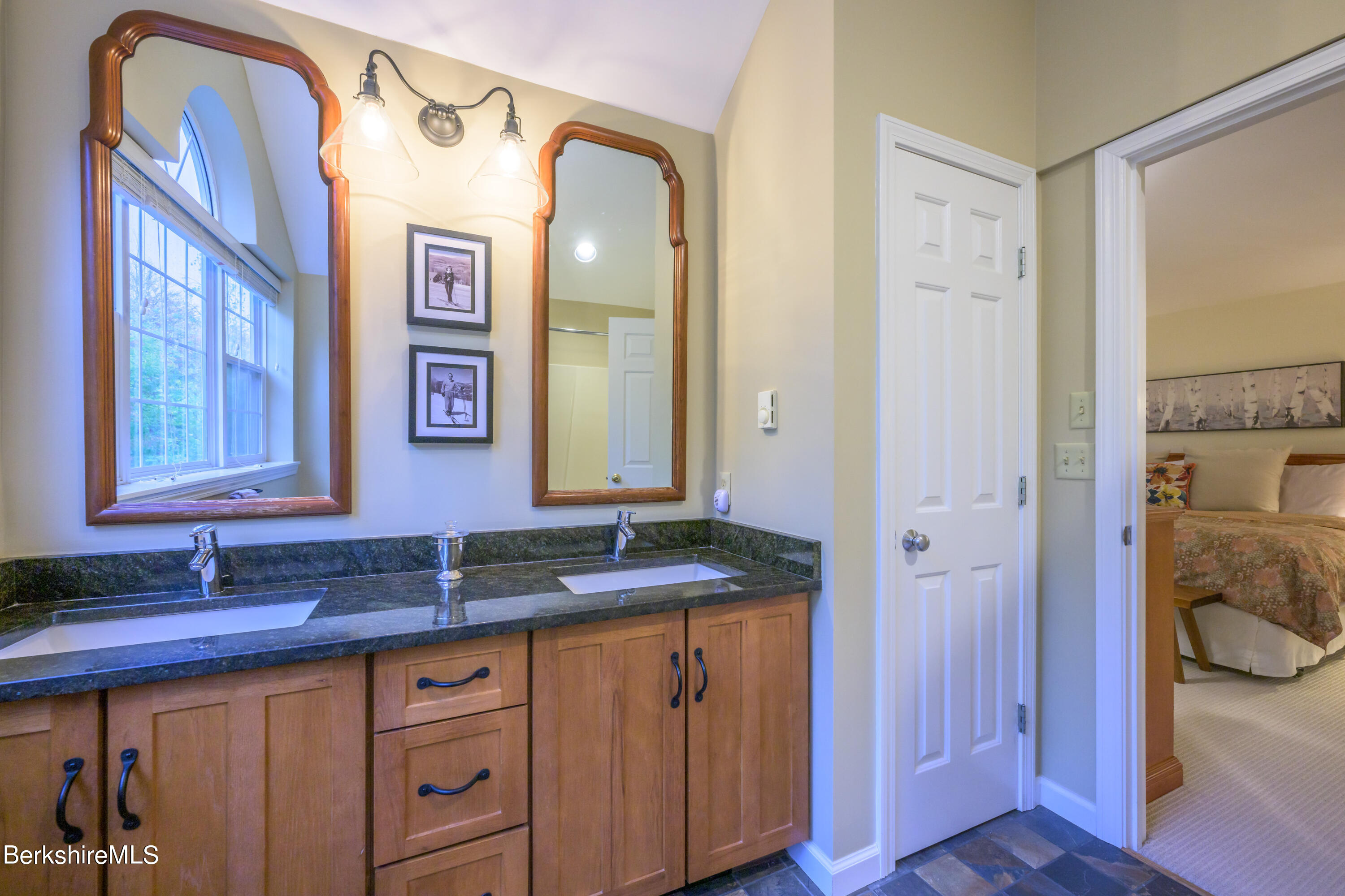 9341 Mountainside Drive Hancock, MA 01237 - Photo 29 of 43 a bathroom with a granite countertop sink and a mirror