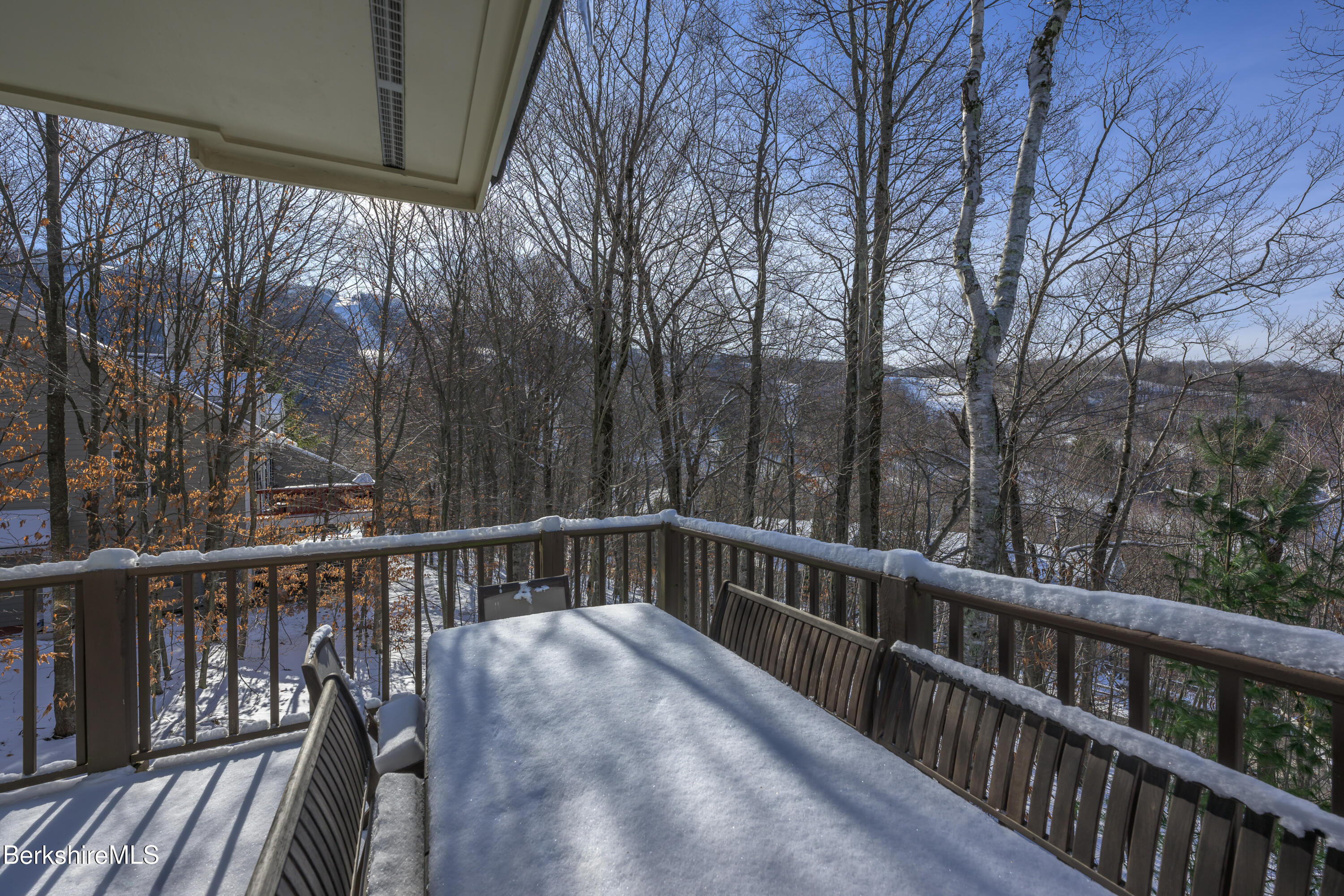 9341 Mountainside Drive Hancock, MA 01237 - Photo 3 of 43 a view of balcony with wooden floor and fence