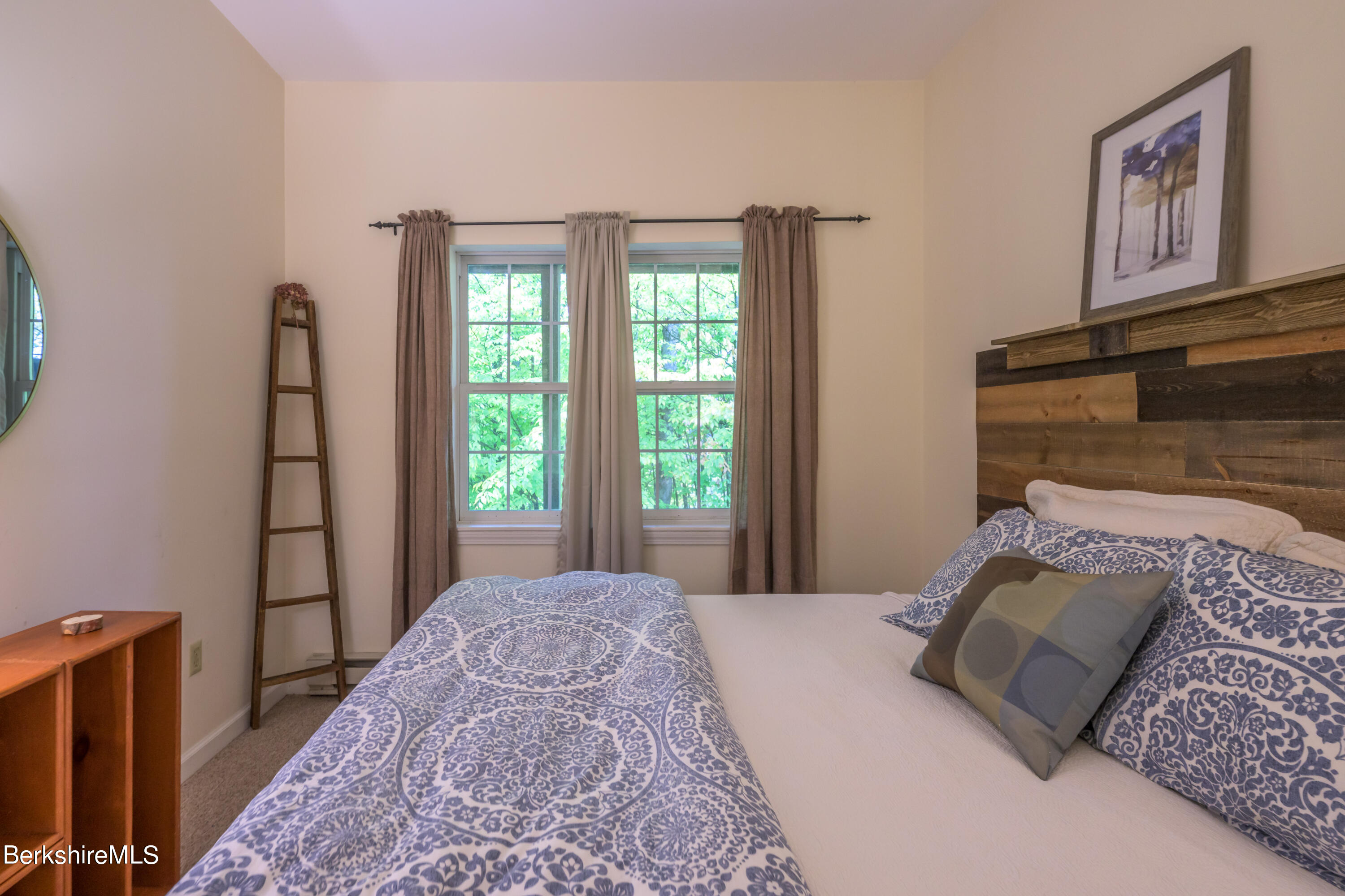 9341 Mountainside Drive Hancock, MA 01237 - Photo 36 of 43 a bedroom with a bed and a window