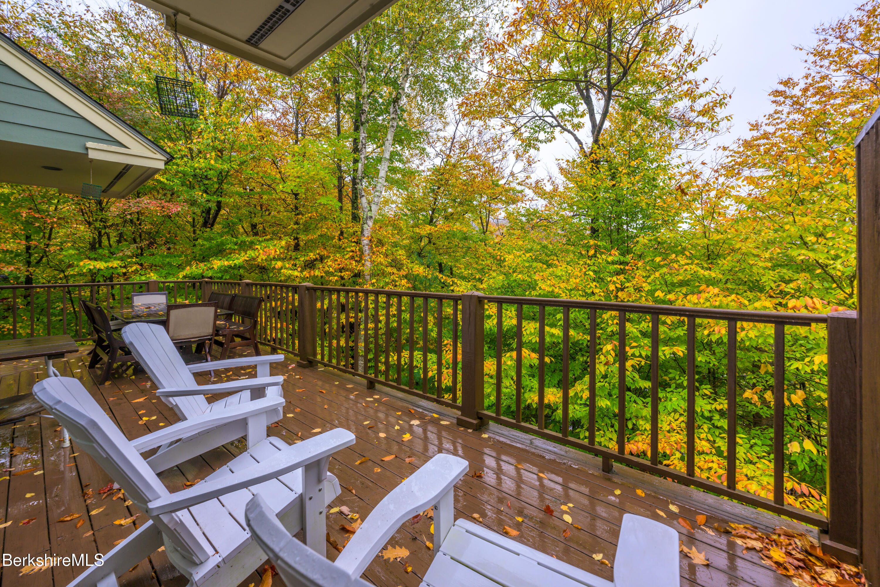 9341 Mountainside Drive Hancock, MA 01237 - Photo 9 of 43 a view of a chairs and table in patio