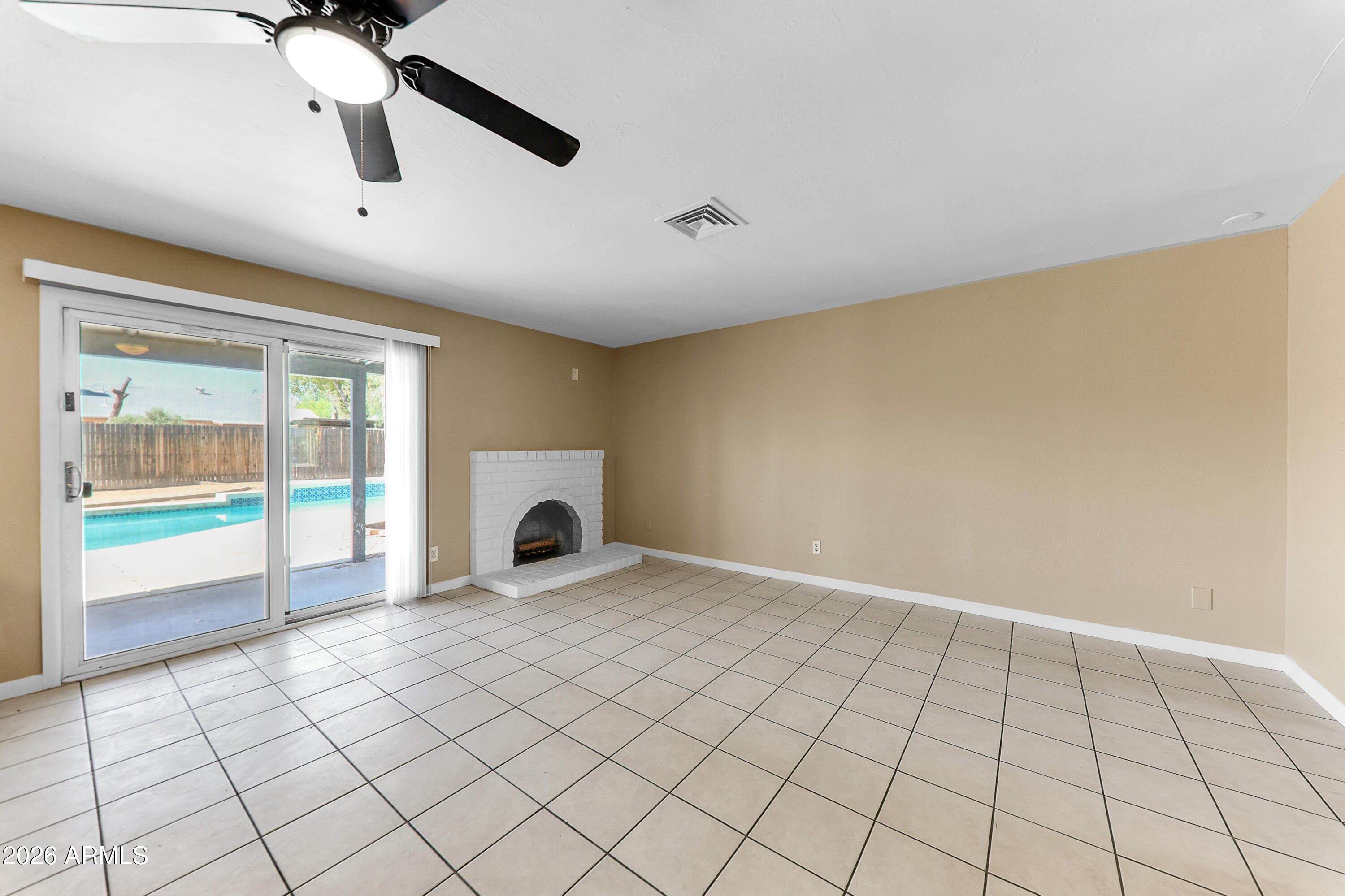 4723 East Vineyard Road Phoenix, AZ 85042 - Photo 9 of 27 a view of an empty room and window