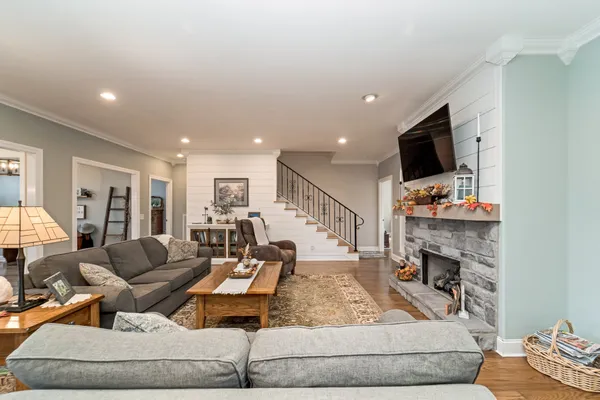 a living room with furniture and a flat screen tv