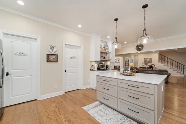 a view of a center island and living room