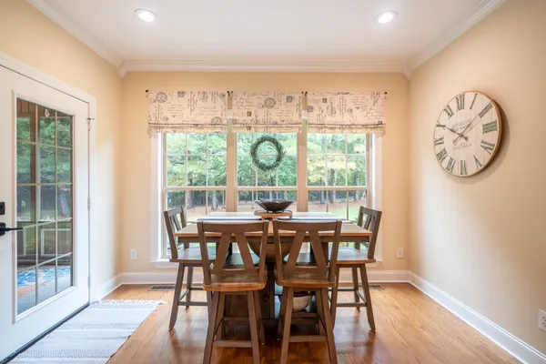 a view of a dining room with furniture window and outside view