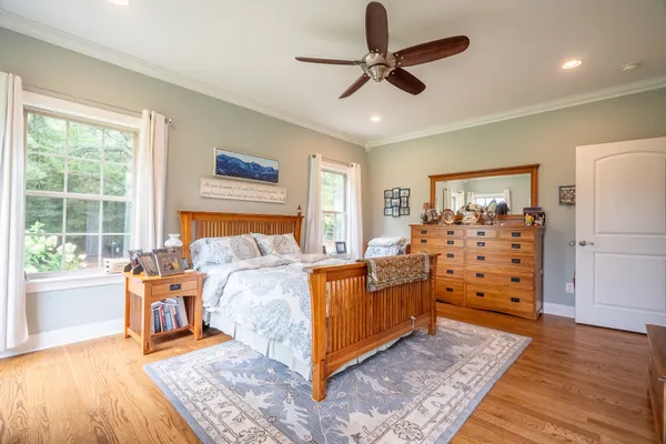 a bed room with furniture and wooden floor
