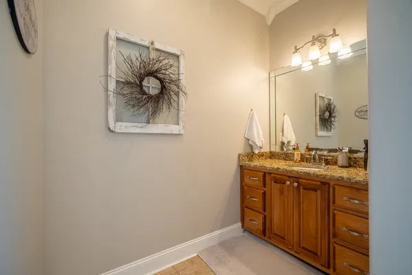 a bathroom with a double vanity sink and a mirror