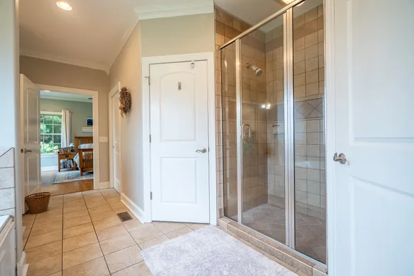 a bathroom with a glass shower door