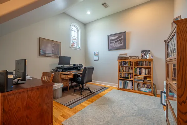 a workspace with furniture and book shelf